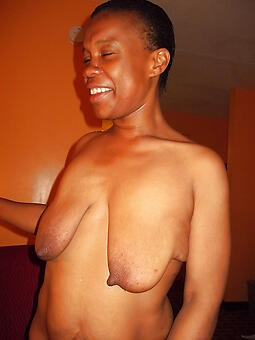 ebony woman with saggy tits by way of a XXX striptease